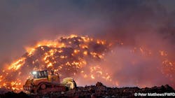 A payloader moves burning debris around at the Fort Worth recycling yard. A payloader moves burning debris around at the Fort Worth recycling yard.