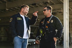 LA Rams General Manager Les Snead talks with a Los Angeles Fire helicopter crew member. LA Rams General Manager Les Snead talks with a Los Angeles Fire helicopter crew member.