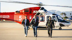 LA Rams Head Coach Sean McVay and General Manager Les Snead walk with Los Angeles Fire Department Battalion Chief Brett Willis during a promotional video shoot for the NFL draft.