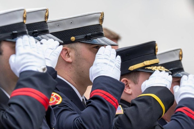 Colleagues salute Kansas City Paramedic Graham Hoffman.