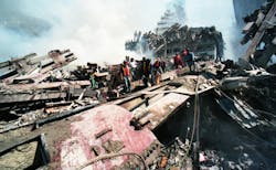 FDNY firefighters search the ruins of the World Trade Center. FDNY firefighters search the ruins of the World Trade Center.