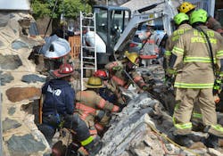 Special operations teams from the Baltimore City Fire Department, Baltimore County Fire Department and Howard County Fire and Rescue Services worked at the site of a trench collapse alongside a 10 x 15-foot stone wall. Two workers were in an 8-foot deep trench to reinforce a basement wall of a house when the wall fell outward and onto them. At least 50 rescue technicians worked for about seven hours to extricate the victims, who were pronounced dead on scene. Special operations teams from the Baltimore City Fire Department, Baltimore County Fire Department and Howard County Fire and Rescue Services worked at the site of a trench collapse alongside a 10 x 15-foot stone wall. Two workers were in an 8-foot deep trench to reinforce a basement wall of a house when the wall fell outward and onto them. At least 50 rescue technicians worked for about seven hours to extricate the victims, who were pronounced dead on scene.