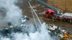 Detroit firefighters operate at scrap yard fire.