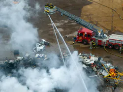 Detroit firefighters operate at scrap yard fire. Detroit firefighters operate at scrap yard fire.