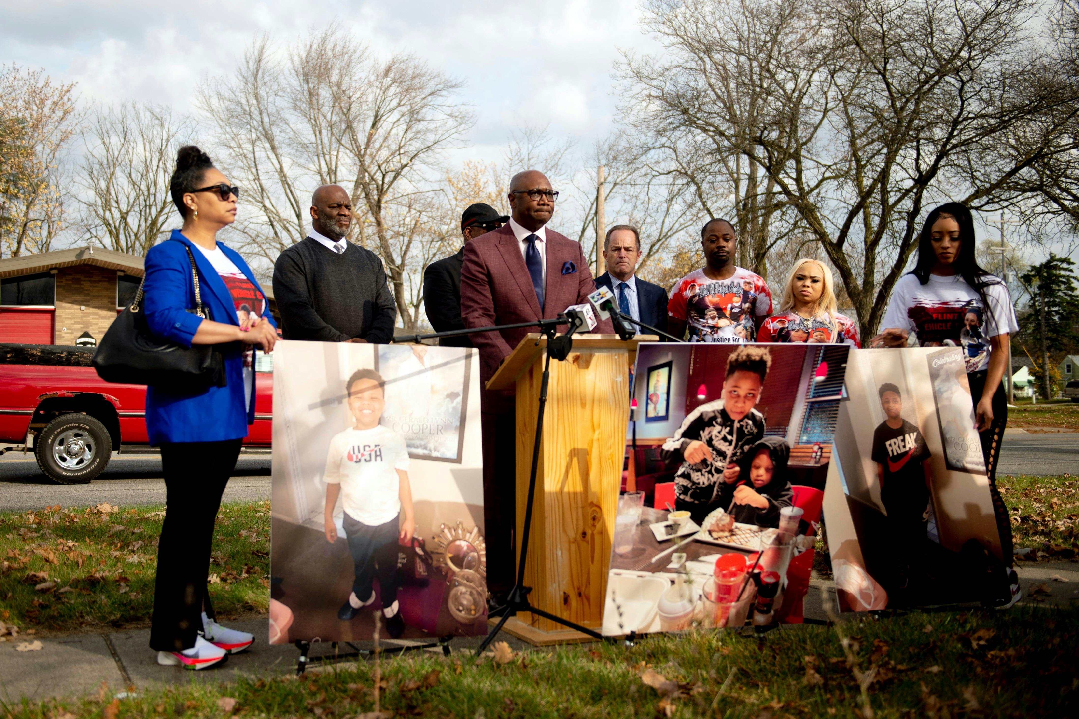 Attorney Robert Kenner Jr. speaks as with family, pastors and others addressing refiling and/or amending a lawsuit against the city of Flint, its fire department and two firefighters who declared an all clear.