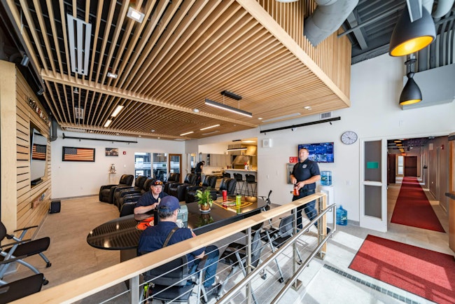 Interior spaces, with strategic color, material schemes, and natural daylighting allow for firefighters to unwind and enjoy camaraderie.