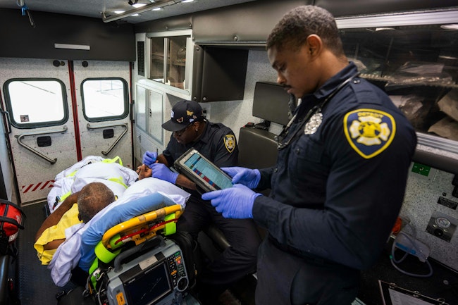 Detroit EMT Bacarri Stanley works on a patient care report.