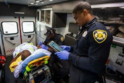 Detroit EMT Bacarri Stanley works on a patient care report. Detroit EMT Bacarri Stanley works on a patient care report.