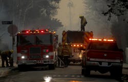 In this file photo, firefighters prepare to douse hot spots during the January wildfires in Pacific Palisades. In this file photo, firefighters prepare to douse hot spots during the January wildfires in Pacific Palisades.