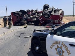 Two firefighters were hurt when their fire truck overturned after a collision. Two firefighters were hurt when their fire truck overturned after a collision.