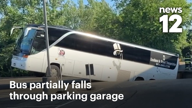 Tour Bus Partially Falls Through Parking Garage in New Hyde Park, NY