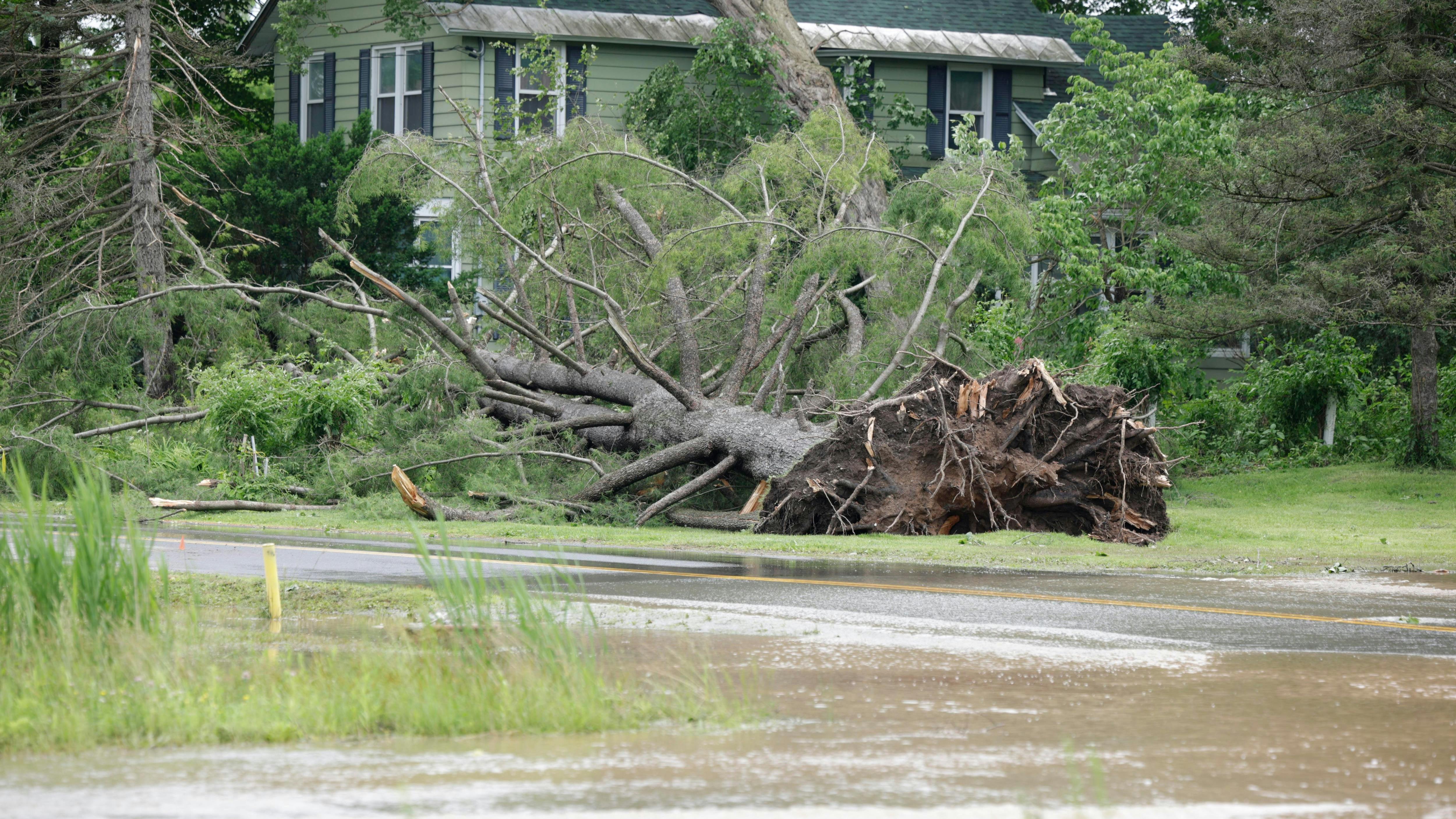 An 86-year-old couple was trapped in a camper that was crushed by a fallen free when a severe storm tore through Central New York.