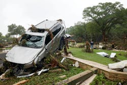 A car is piled up on debris on Saturday in Hunt, TX, a day after a flash flood swept through the area early Friday morning. A car is piled up on debris on Saturday in Hunt, TX, a day after a flash flood swept through the area early Friday morning.