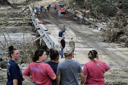 Workers and law enforcement search for missing people near Camp Mystic in Hunt, TX. Workers and law enforcement search for missing people near Camp Mystic in Hunt, TX.