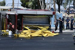 Firefighters were responding to a house fire Thursday when the rig overturned and emptied the hose bed. Firefighters were responding to a house fire Thursday when the rig overturned and emptied the hose bed.