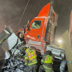 This semitrailer cab was lifted by a rotator that was positioned on an overpass above the scene. This allowed rescuers to tunnel into a van and rescue two people following a pileup on the Ohio Turnpike. This semitrailer cab was lifted by a rotator that was positioned on an overpass above the scene. This allowed rescuers to tunnel into a van and rescue two people following a pileup on the Ohio Turnpike.