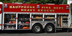 The Hauppauge, NY, Fire Department had Rescue 1 build its new rescue using a Spartan Gladiator four-door cab while maintaining a walk-in body. The roll-up doors provide a cleaner access to all tools and equipment. Note the use of aluminum tread plate around the tandem-axle area. The Hauppauge, NY, Fire Department had Rescue 1 build its new rescue using a Spartan Gladiator four-door cab while maintaining a walk-in body. The roll-up doors provide a cleaner access to all tools and equipment. Note the use of aluminum tread plate around the tandem-axle area.