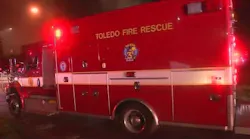 Two firefighters hospitalized after being hit by fallen debris in central Toledo blaze