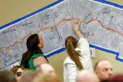Women look over a map of the Guadalupe River during a joint hearing of the Texas Senate and House Select Committees Thursday. Women look over a map of the Guadalupe River during a joint hearing of the Texas Senate and House Select Committees Thursday.
