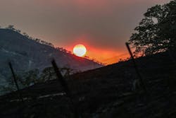 Smoke from the Gifford Fire filters sunlight over the burned hills near the Cuyama Highway. Smoke from the Gifford Fire filters sunlight over the burned hills near the Cuyama Highway.