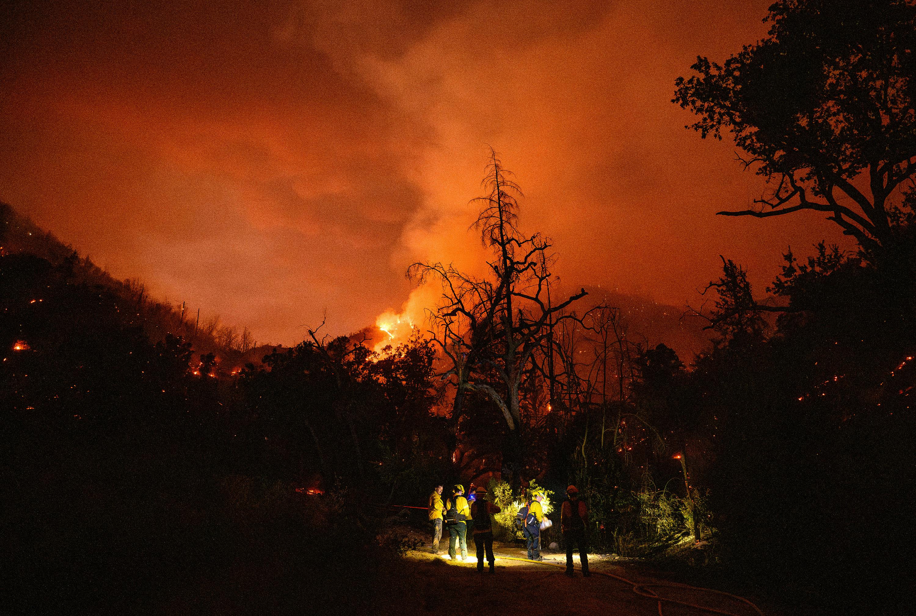 Firefighters prepare to move out as the Pickett fire burns in Calistoga, CA, late last week.