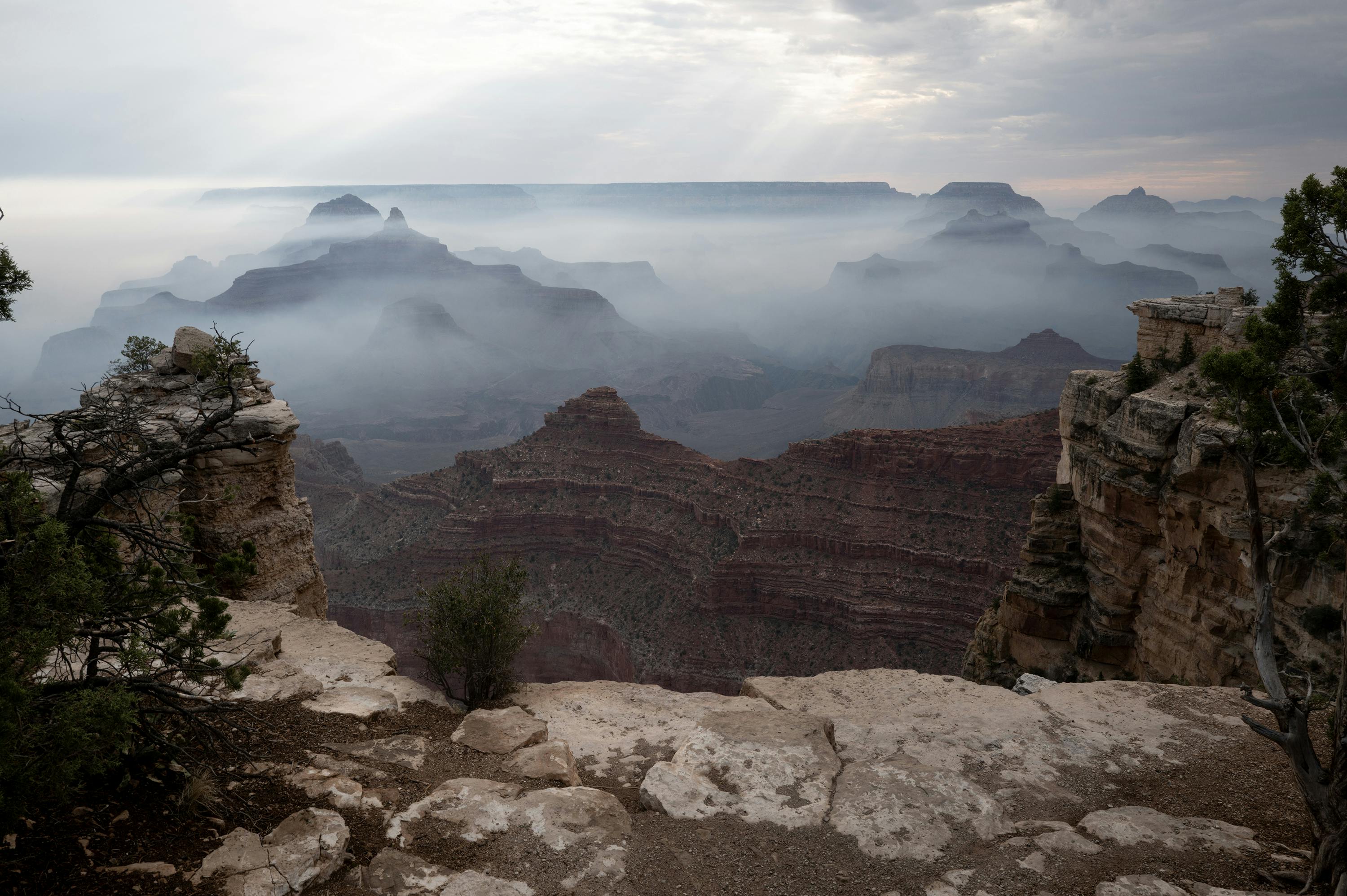 Smoke from the Dragon Bravo fire settles into the Grand Canyon along the South Rim near Mather Point on July 17, 2025, in Grand Canyon, Arizona.