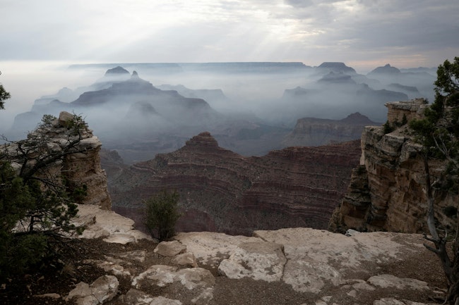 Smoke from the Dragon Bravo fire settles into the Grand Canyon along the South Rim near Mather Point on July 17, 2025, in Grand Canyon, Arizona.