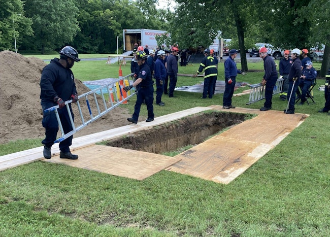 Making the lip on the trench safe and placing/moving ladders are key tasks that members of first-arriving companies can assist with under the guidance of a technical rescue team member. This safely engages the first-arriving companies and frees up technical rescue team members for more technical tasks.