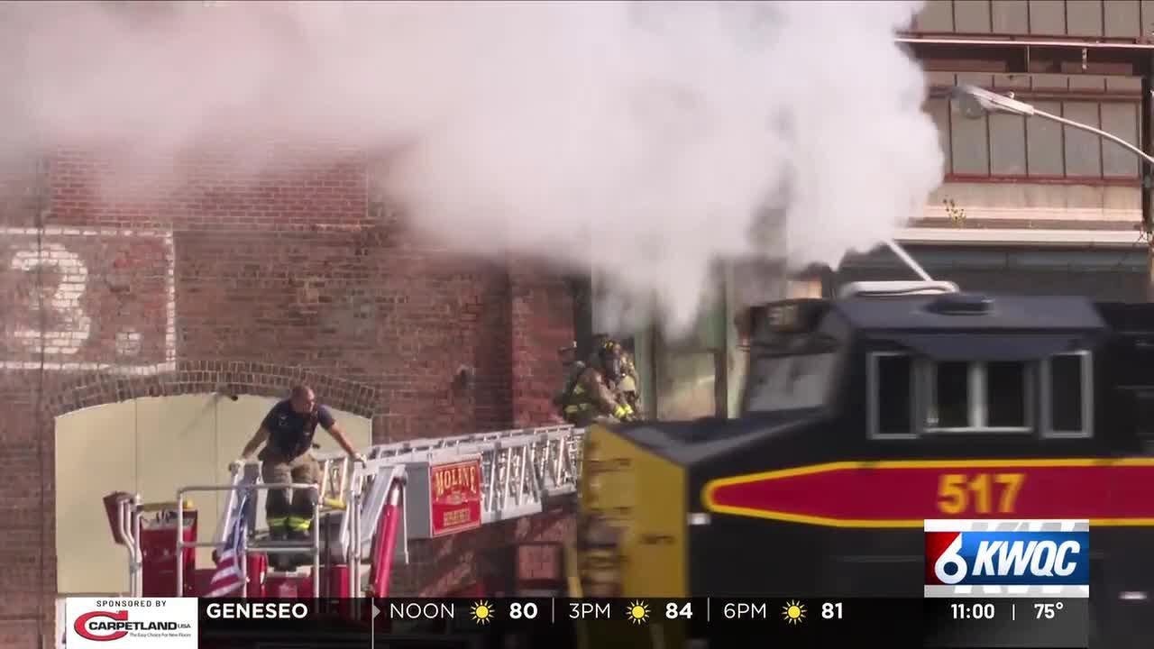 Train hits back of Moline ladder truck at fire