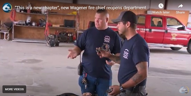 Wagener Fire Chief Hendrik Swanepoel, left, and Capt. Dylan Ortega discuss operations in the engine bay.