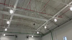 A flat commercial roof might hide a bowstring truss (shown here) or lightweight steel bar joists, both of which are prone to early failure.