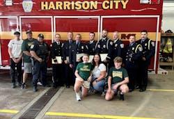 Firefighters found Kayli Kiss, 11, unconscious on the second floor of the house and brought her to safety. She met her rescuers before the football game. Firefighters found Kayli Kiss, 11, unconscious on the second floor of the house and brought her to safety. She met her rescuers before the football game.