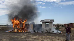 Anne Cope, chief engineer for Insurance Institute for Business and Home Safety, speaks during a burn demonstration at the Sacramento City Fire Training Facility at McClellan Airfield on Wednesday.