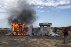 Anne Cope, chief engineer for Insurance Institute for Business and Home Safety, speaks during a burn demonstration at the Sacramento City Fire Training Facility at McClellan Airfield on Wednesday. Anne Cope, chief engineer for Insurance Institute for Business and Home Safety, speaks during a burn demonstration at the Sacramento City Fire Training Facility at McClellan Airfield on Wednesday.