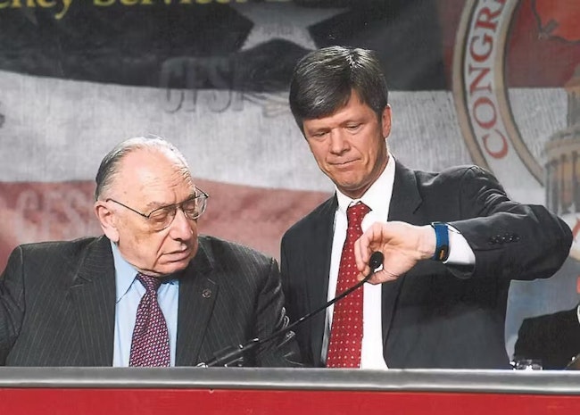 Longtime Firehouse Columnist, the late Hal Bruno, left, and CFSI Executive Director Bill Webb take the podium during an annual Congressional Fire Services Institute dinner.