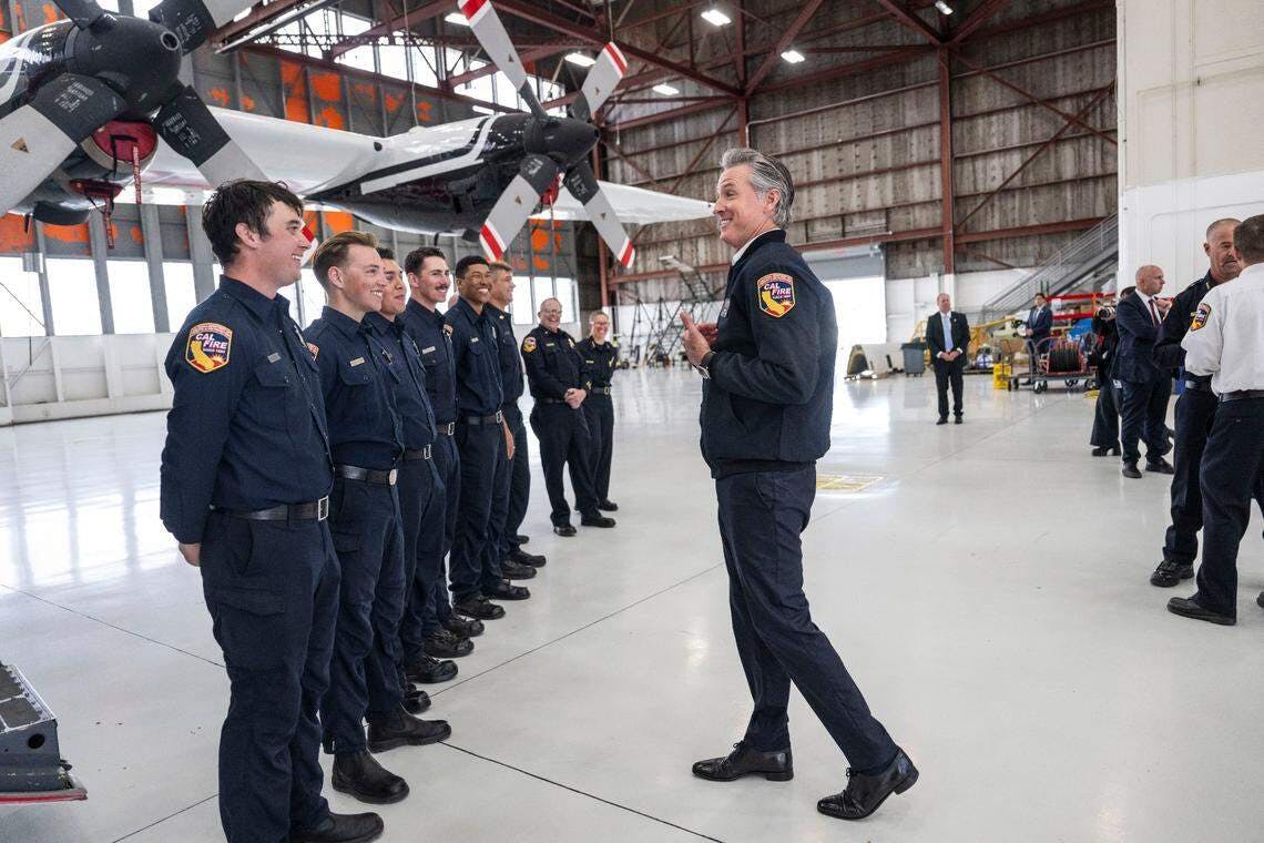 Gov. Gavin Newsom talks with CAL FIRE at a recent event.