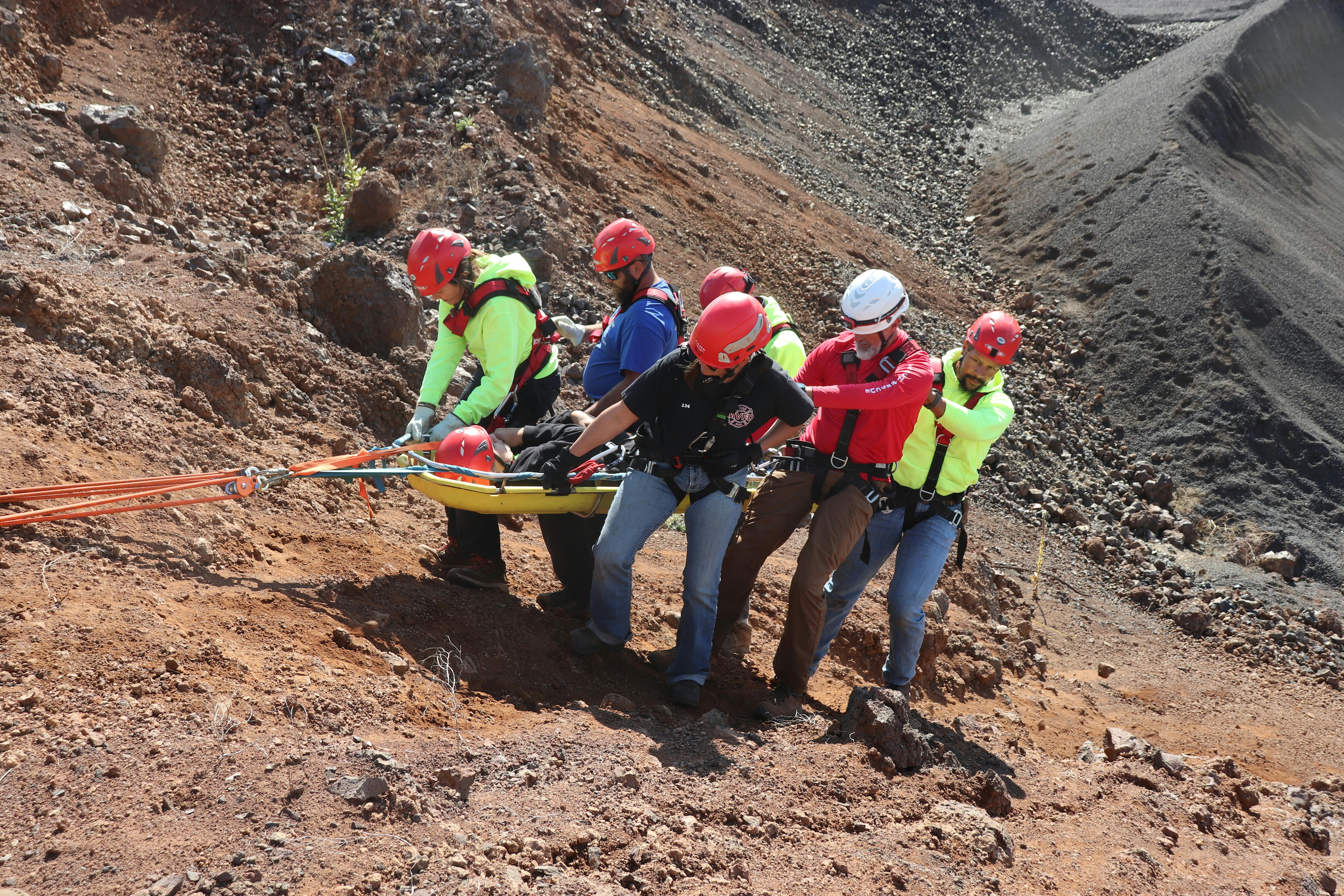 Members of the Meadows Valley Fire Department, Grangeville Mountain Rescue Unit, Riggins Ambulance and Valley County Search and Rescue practice carrying a stokes basket down the side of a rock face. The training was part of the annual Introduction to Rope Rescue training event held in New Meadows.
