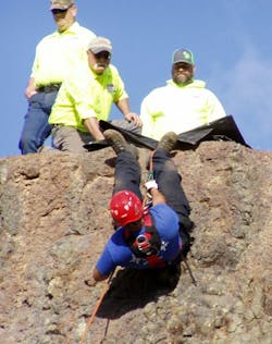 Brian Adams and John Finley of the Grangeville Mountain Rescue Unit look on as Trevor Dukes of the Riggins Ambulance practices “righting” himself after losing his footing on a rock face. The training was part of the annual Introduction to Rope Rescue training event held in New Meadows. Brian Adams and John Finley of the Grangeville Mountain Rescue Unit look on as Trevor Dukes of the Riggins Ambulance practices “righting” himself after losing his footing on a rock face. The training was part of the annual Introduction to Rope Rescue training event held in New Meadows.