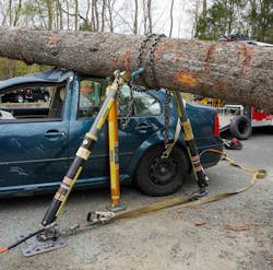 A tree that’s on the roof of a car that’s on its four wheels initially might not seem like anything special or unique. However, the tree itself is full of concerns to consider. The round shape of the tree trunk creates the issue in which it can roll in either direction off of the roof. Where the tree landed can influence the thought process greatly. Is it at the midpoint of the tree, to the extent that it’s teetering in the center? Is only one end of it on the vehicle? How is it stabilized? Can a strut be used, or is it best to set up a chain basket in coordination with the struts? A tree that’s on the roof of a car that’s on its four wheels initially might not seem like anything special or unique. However, the tree itself is full of concerns to consider. The round shape of the tree trunk creates the issue in which it can roll in either direction off of the roof. Where the tree landed can influence the thought process greatly. Is it at the midpoint of the tree, to the extent that it’s teetering in the center? Is only one end of it on the vehicle? How is it stabilized? Can a strut be used, or is it best to set up a chain basket in coordination with the struts?