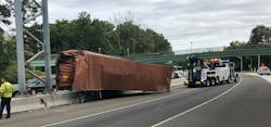 When this intermodal shipping container came off of the trailer, struck some signage and was left leaning on the jersey barrier, should struts and cribbing have been used? Was someone wedged somewhere, which could present the requirement for lift, rather than simply leaving it in place for the wrecker to remove it from the roadway? When this intermodal shipping container came off of the trailer, struck some signage and was left leaning on the jersey barrier, should struts and cribbing have been used? Was someone wedged somewhere, which could present the requirement for lift, rather than simply leaving it in place for the wrecker to remove it from the roadway?