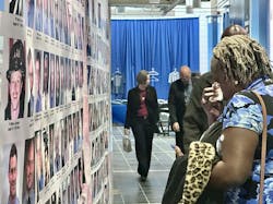 The daughter of fallen FDNY firefighter Charles Williams wipes tears afte seeing their father's photo and name on the memorial wall. The daughter of fallen FDNY firefighter Charles Williams wipes tears afte seeing their father's photo and name on the memorial wall.