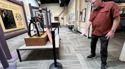 Hall of Flame Executive Director Chuck Montgomery shows points to where water damage the Hall of Heroes at the Phoenix fire museum following two storms.