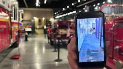 Chuck Montgomery shows a photo during the cleanup efforts of the Hall of Flame following flooding from a September monsoon in Phoenix. Chuck Montgomery shows a photo during the cleanup efforts of the Hall of Flame following flooding from a September monsoon in Phoenix.