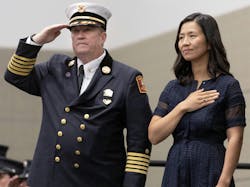 Boston Fire Commissioner Paul Burke and Mayor Michelle Wu stand at a recent fire department graduation ceremony Boston Fire Commissioner Paul Burke and Mayor Michelle Wu stand at a recent fire department graduation ceremony