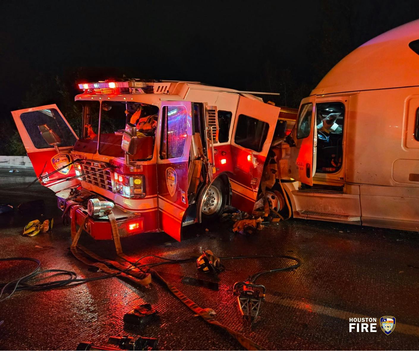 Four Houston firefighters were injured Sunday when their pumper was struck by a tractor-trailer.
