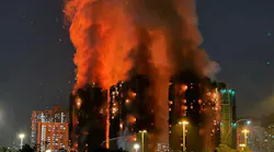 Thick smoke and flames rise as a major fire engulfs several apartment blocks at the Wang Fuk Court residential estate in Hong Kong's Tai Po district on Nov. 26, 2025. At least 36 people were killed when a fire engulfed several high-rise blocks in a Hong Kong residential estate on Nov. 26, the government said, with media reporting that some residents were trapped inside. (Yan Zhao/AFP via Getty Images/TNS)