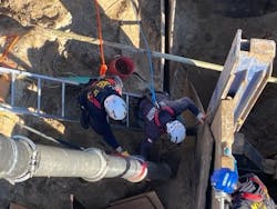 Firefighters used both the vacuum truck and hand tools to remove soil from around the in multiple attempts to rescue the victim from the collapsed trench. Firefighters used both the vacuum truck and hand tools to remove soil from around the in multiple attempts to rescue the victim from the collapsed trench.
