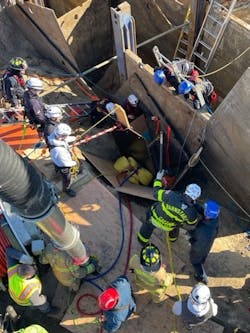 An overview of the scene where firefighters from Yarmouth and the Barnstable County Technical Rescue Team worked to rescue one victim and recover another victim who were caught in a trench collapse. An overview of the scene where firefighters from Yarmouth and the Barnstable County Technical Rescue Team worked to rescue one victim and recover another victim who were caught in a trench collapse.