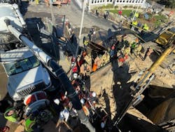 The vacuum truck was used to lower a shoring panel with a strongback and then ground ladders were placed inside the trench box so rescuers could climb to the top and help those working below. The vacuum truck was used to lower a shoring panel with a strongback and then ground ladders were placed inside the trench box so rescuers could climb to the top and help those working below.