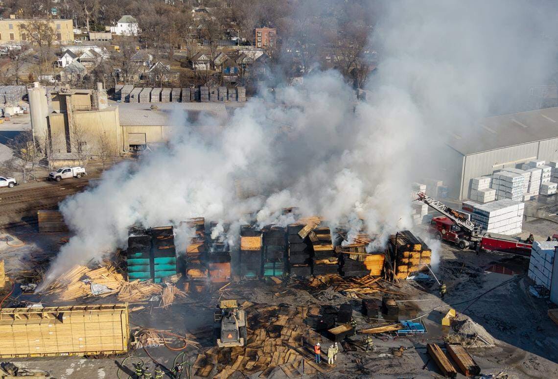 A Kansas City lumberyard continues to burn.